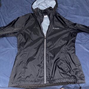 Columbia Black Windbreaker with a hide-able hood